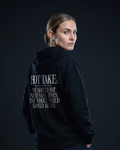 Frau in schwarzem Zip-Hoodie mit dem Rueckenprint 'Hot Take: We should not need safe-zones. The whole world should be one.'