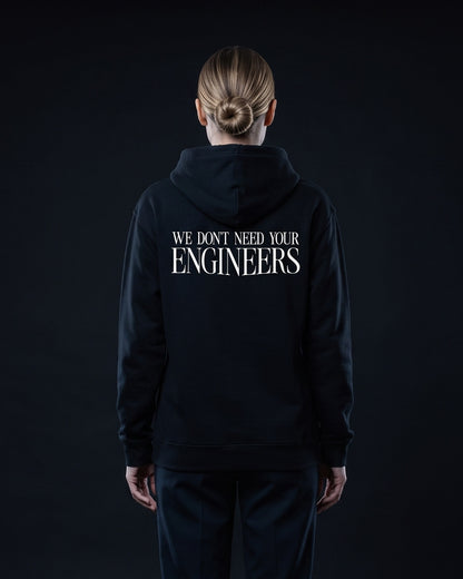 Frau trägt den WORN OPINIONS Hoodie We don't need your Engineers in Schwarz von hinten, Rückenprint We don't need your Engineers